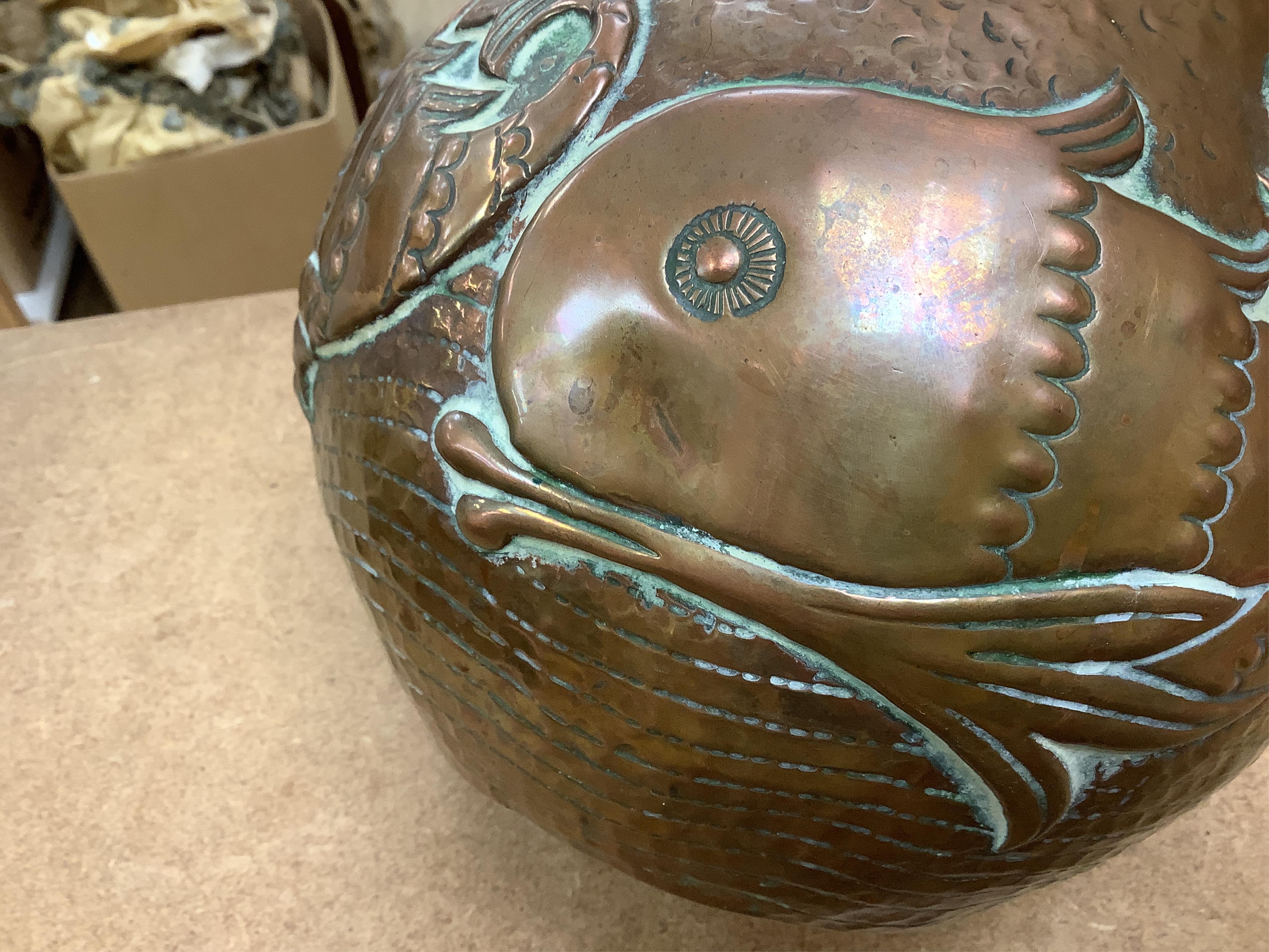 A Newlyn Arts & Crafts jardiniere by John Pearson, decorated with four different fish, signed and numbered 2473. Condition - minor dents, essentially good